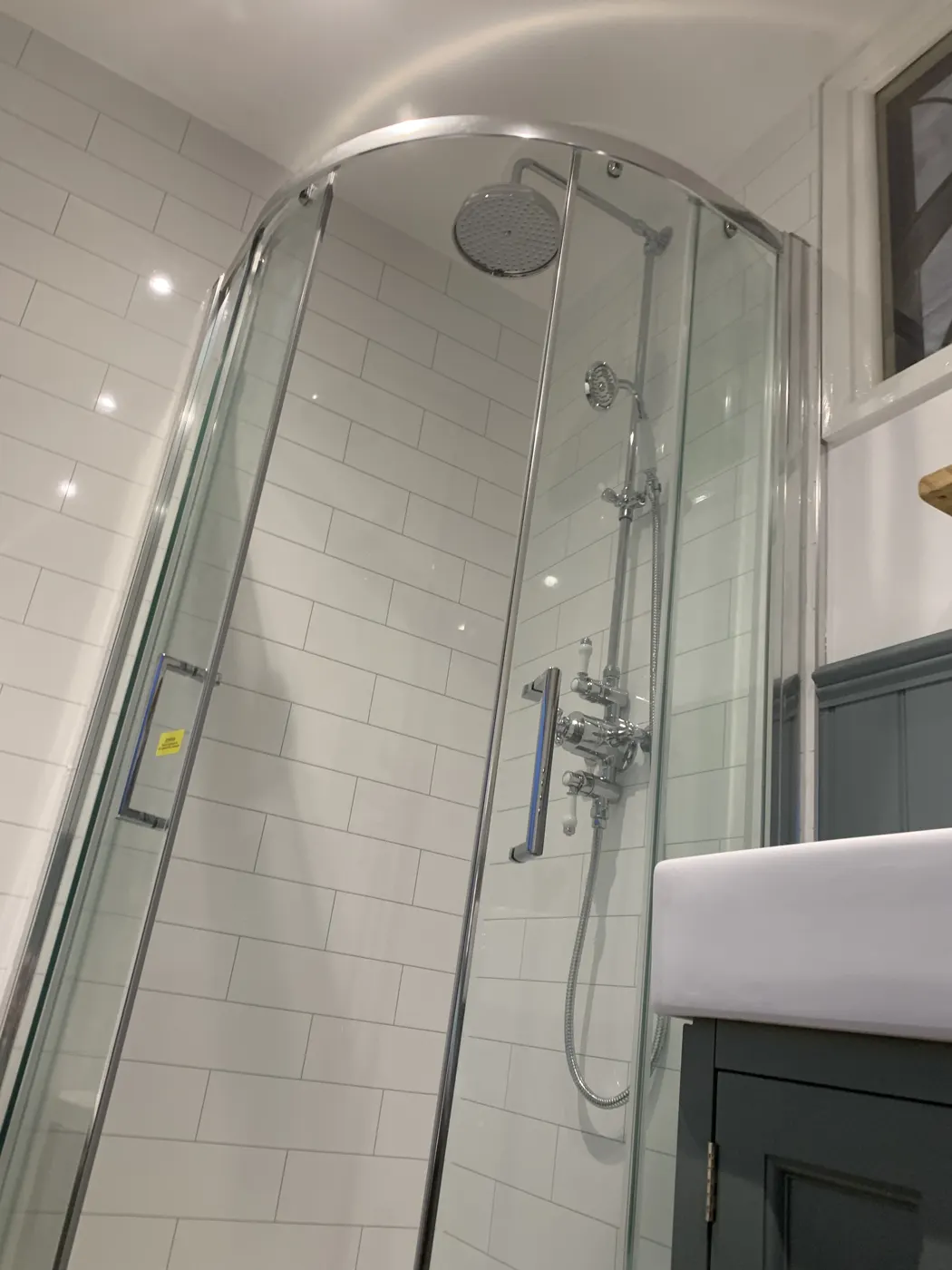 Quadrant shower enclosure with traditional exposed shower valve
